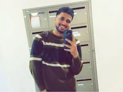 Person smiling in a mirror selfie